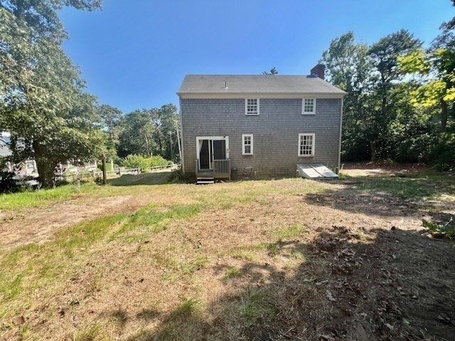41 Woodland Road Chatham, MA 02659 - Photo 15 of 22 a front view of a house with a yard