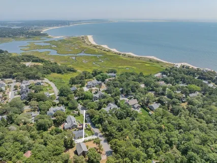 an aerial view of a houses with a yard