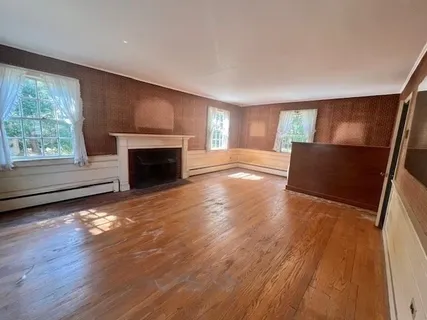 a view of livingroom with hardwood floor and a flat screen tv