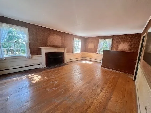a view of livingroom with hardwood floor and a flat screen tv