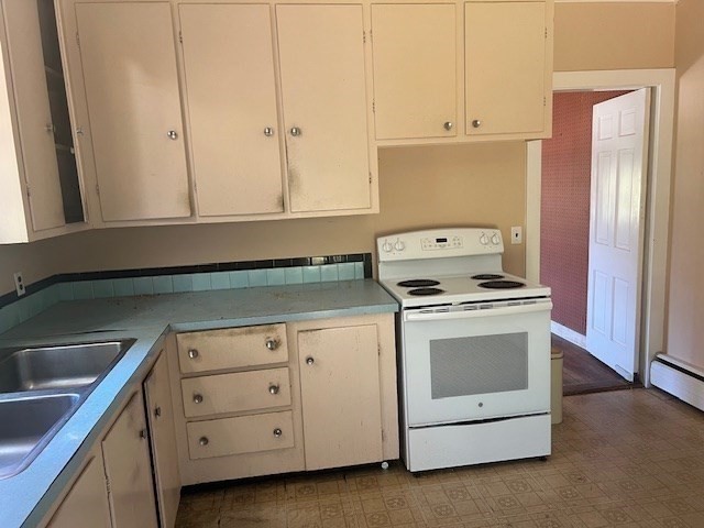 41 Woodland Road Chatham, MA 02659 - Photo 8 of 22 a kitchen with granite countertop white cabinets and white appliances