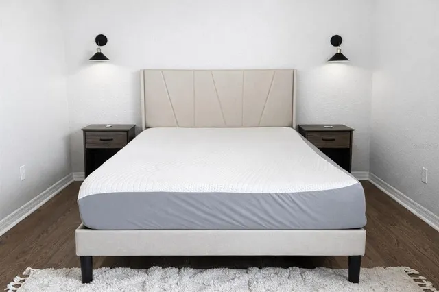 a bathroom with a granite countertop sink mirror and double