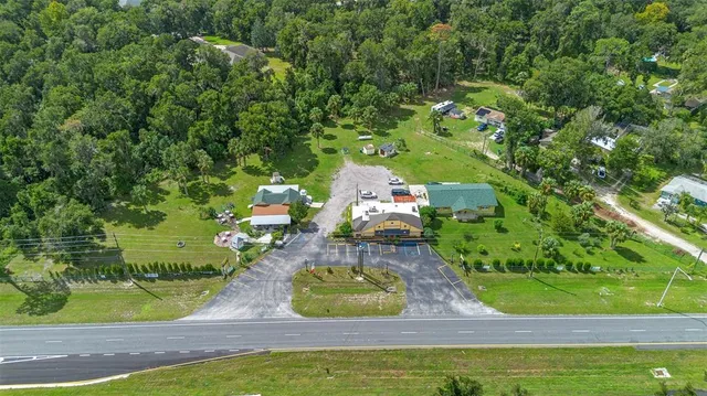 a view of a big house with a street