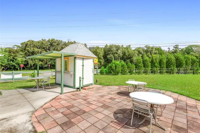 a view of a dining room with furniture window and outdoor view