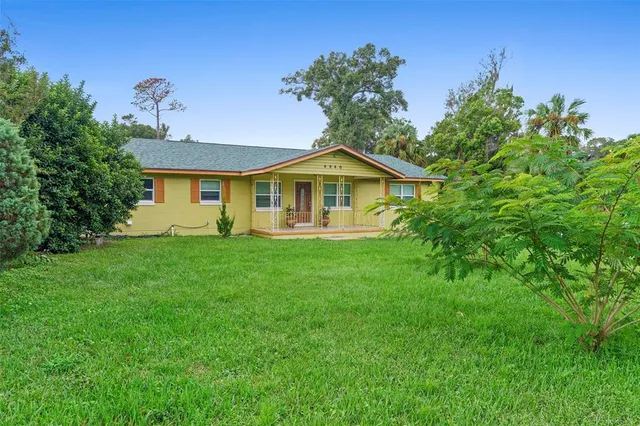 a kitchen with stainless steel appliances a stove and wooden floor