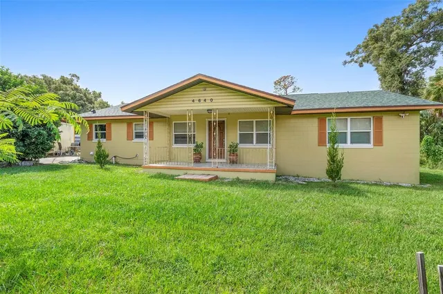 a very nice looking living room with furniture and a large window