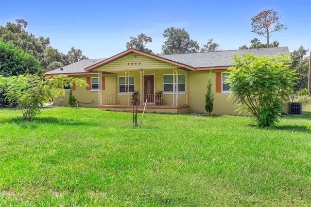 a kitchen with lots of counter top space and stainless steel appliances