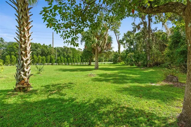 a view of a workspace with furniture and wooden floor