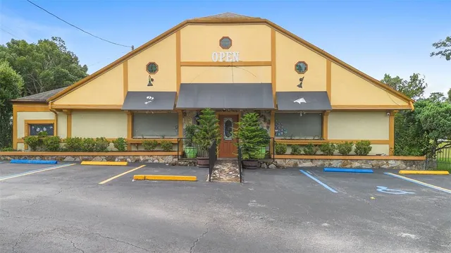 a view of a chairs and table in patio