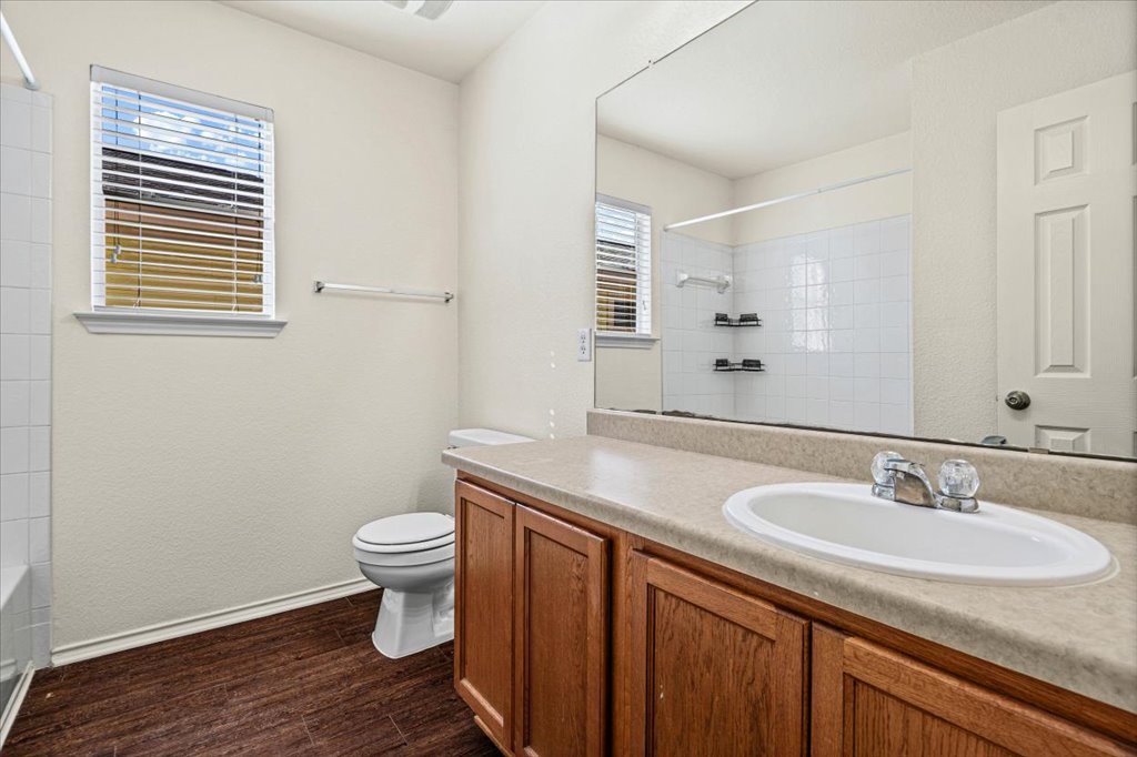 1316 Davis Mountain Loop Cedar Park, TX 78613 - Photo 19 of 24 a bathroom with a sink a toilet and a mirror