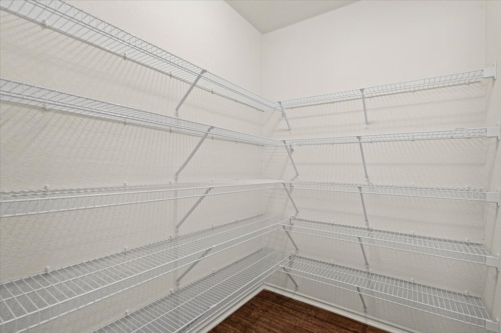 1316 Davis Mountain Loop Cedar Park, TX 78613 - Photo 21 of 24 a view of a room with racks on the wall