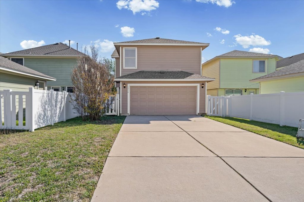 1316 Davis Mountain Loop Cedar Park, TX 78613 - Photo 22 of 24 a view of a house with a yard and a garage