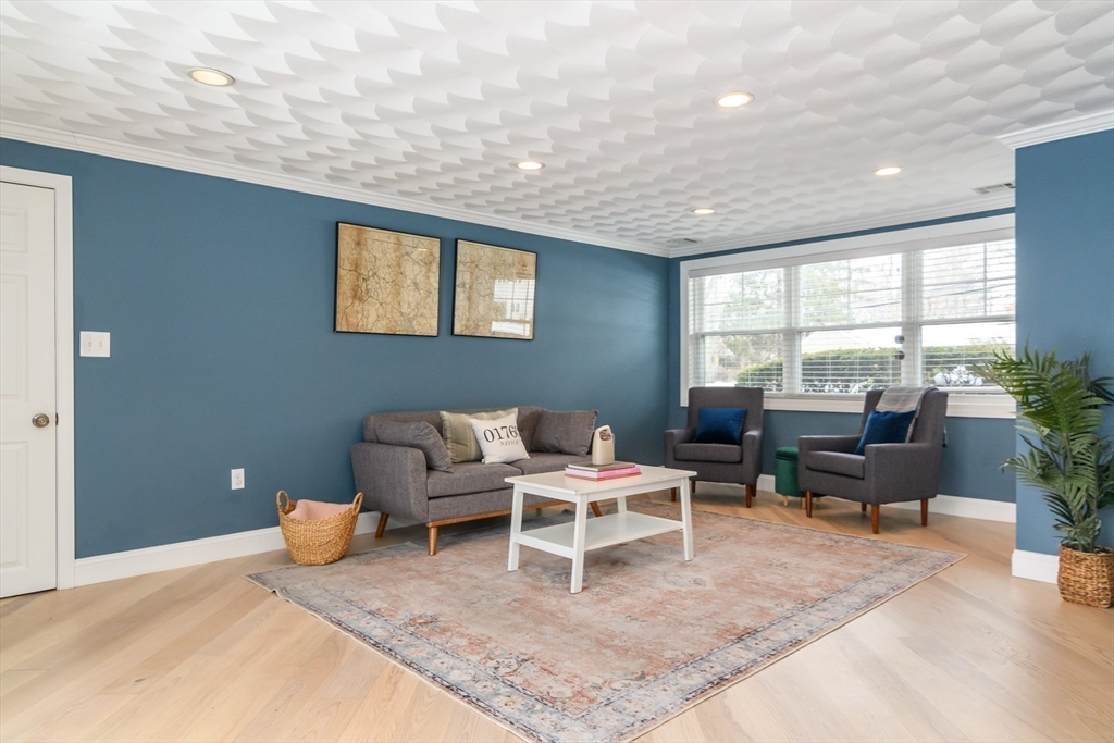 3 Oxbow Road Natick, MA 01760 - Photo 12 of 26 a living room with furniture and a large window