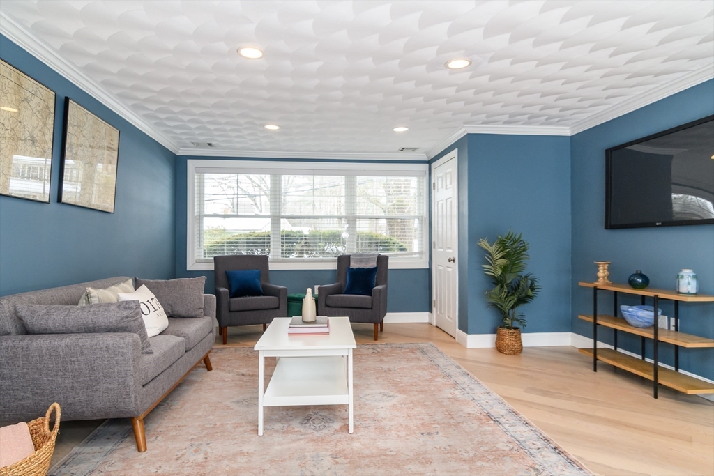 3 Oxbow Road Natick, MA 01760 - Photo 13 of 26 a living room with furniture and a flat screen tv