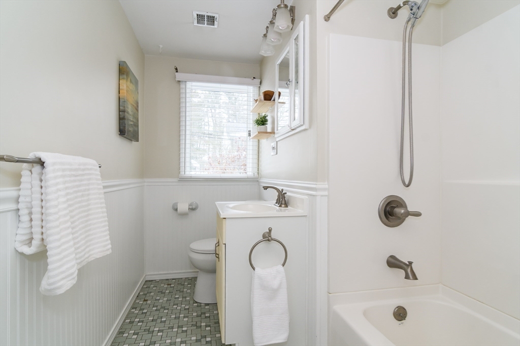 3 Oxbow Road Natick, MA 01760 - Photo 17 of 26 a bathroom with a sink a toilet and a shower