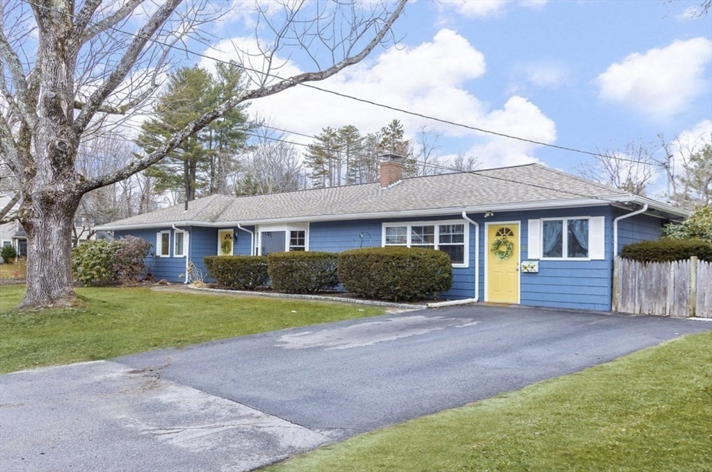 3 Oxbow Road Natick, MA 01760 - Photo 2 of 26 a front view of a house with a yard and trees