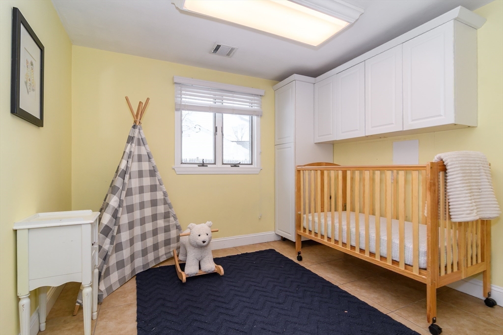 3 Oxbow Road Natick, MA 01760 - Photo 21 of 26 a room with wooden floor pool table and a window
