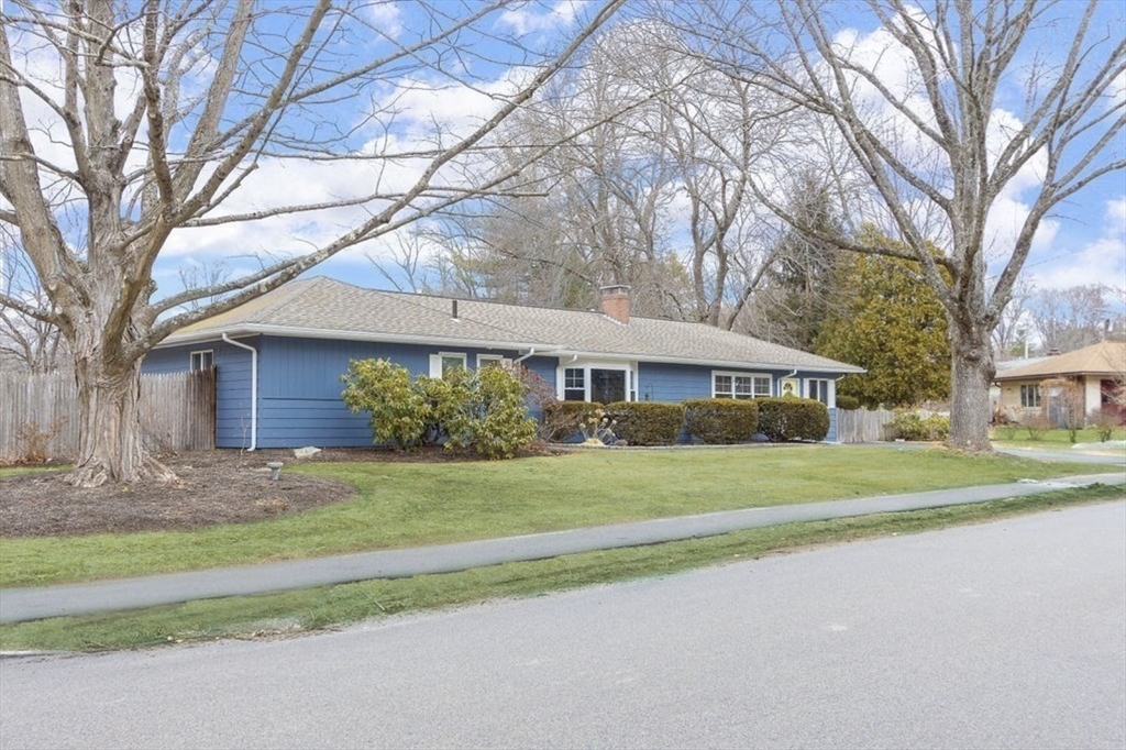 3 Oxbow Road Natick, MA 01760 - Photo 25 of 26 a front view of a house with a yard and garage