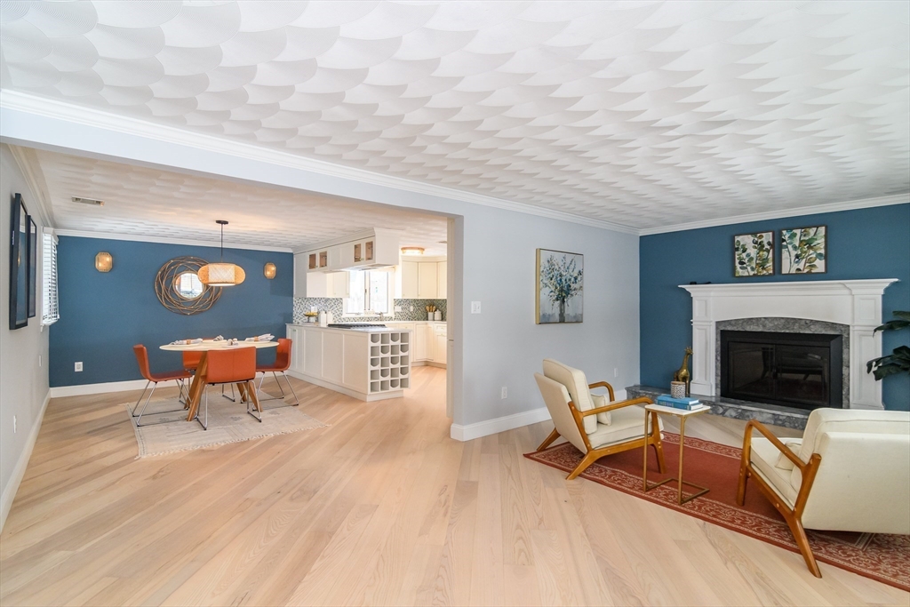 3 Oxbow Road Natick, MA 01760 - Photo 3 of 26 a living room with furniture and a fireplace