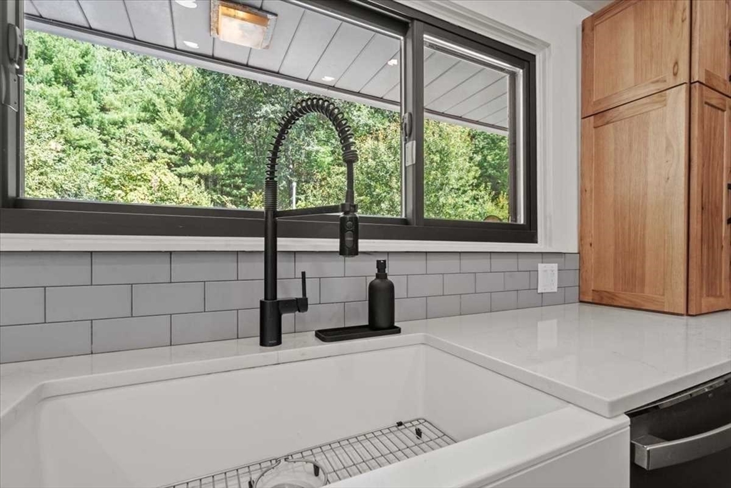 26 West Temple Street Boylston, MA 01505 - Photo 11 of 42 a bathroom with a bathtub and window