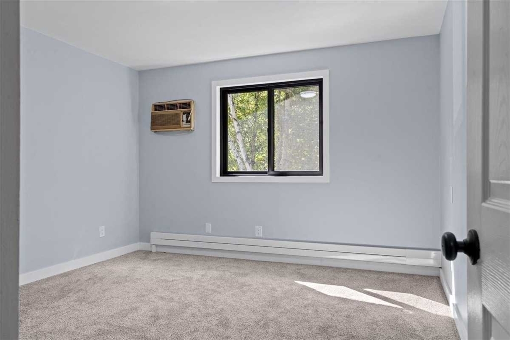 26 West Temple Street Boylston, MA 01505 - Photo 26 of 42 a view of a small space with wooden floor and a window