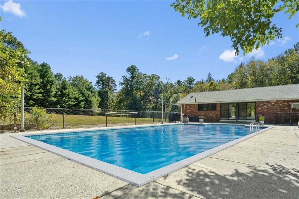 26 West Temple Street Boylston, MA 01505 - Photo 33 of 42 a view of a swimming pool with an outdoor seating