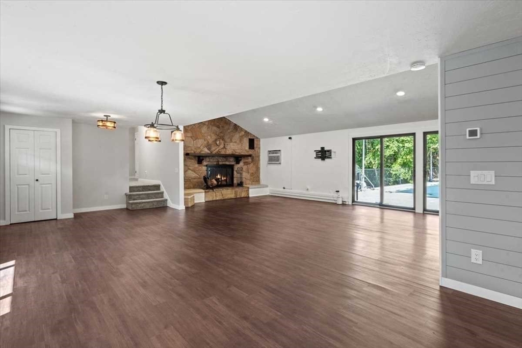 26 West Temple Street Boylston, MA 01505 - Photo 4 of 42 a view of empty room with wooden floor and window