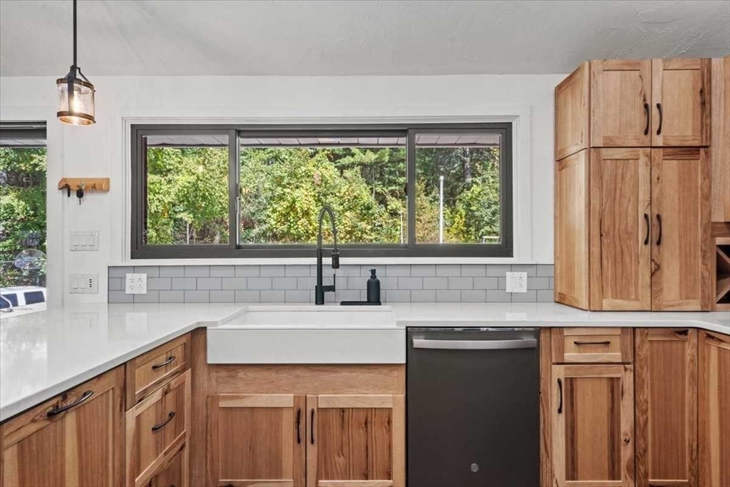 26 West Temple Street Boylston, MA 01505 - Photo 10 of 42 a kitchen with stainless steel appliances granite countertop a sink a window and a counter space