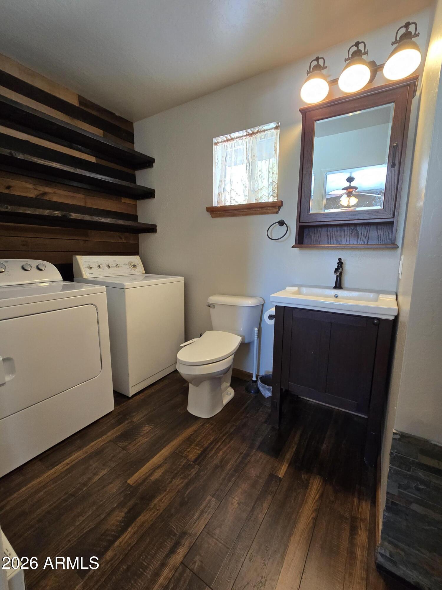 2795 Coyote Ridge Happy Jack, AZ 86024 - Photo 15 of 31 a bathroom with a sink and a mirror