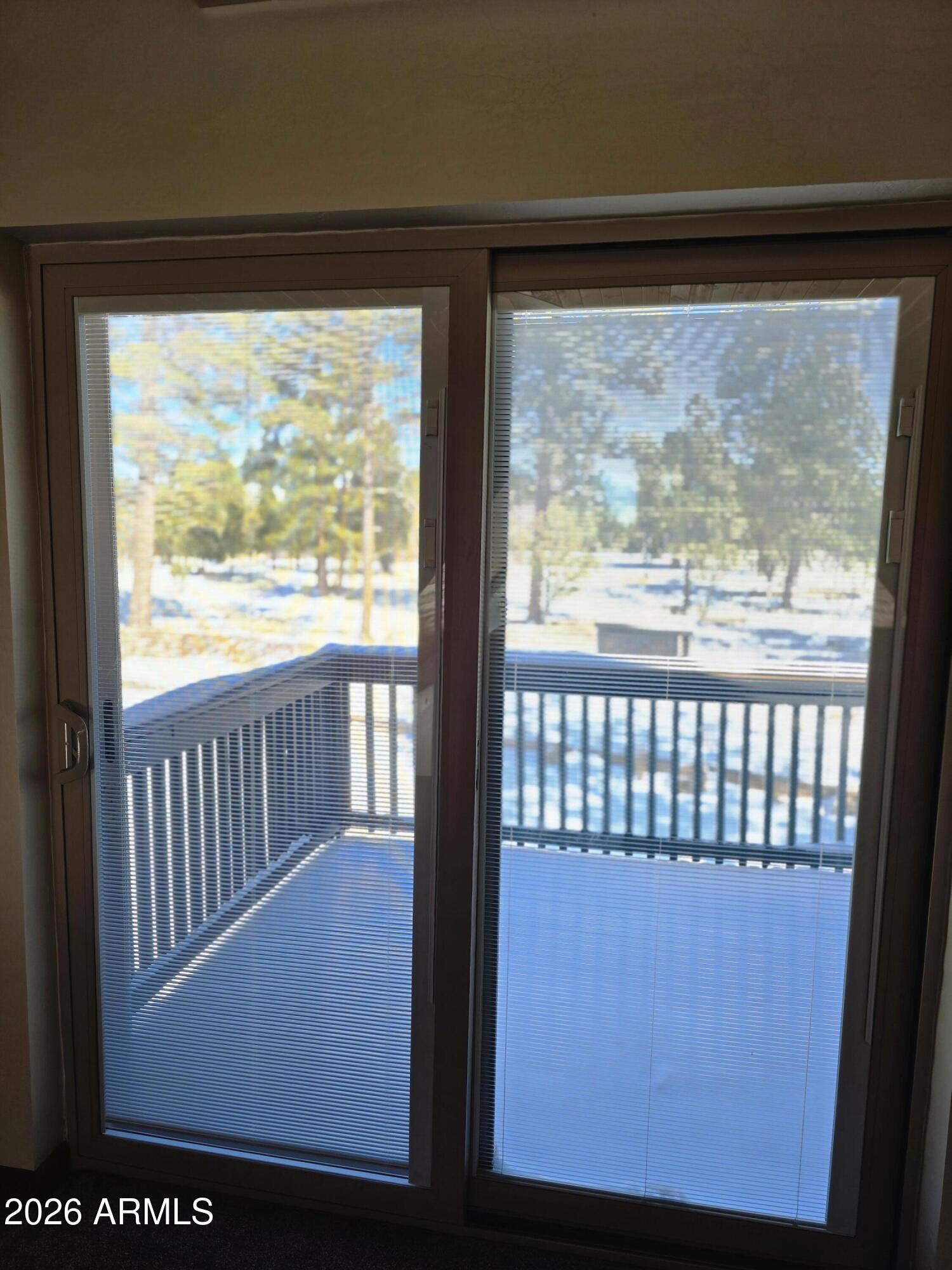 2795 Coyote Ridge Happy Jack, AZ 86024 - Photo 22 of 31 a view of a glass door with a large window