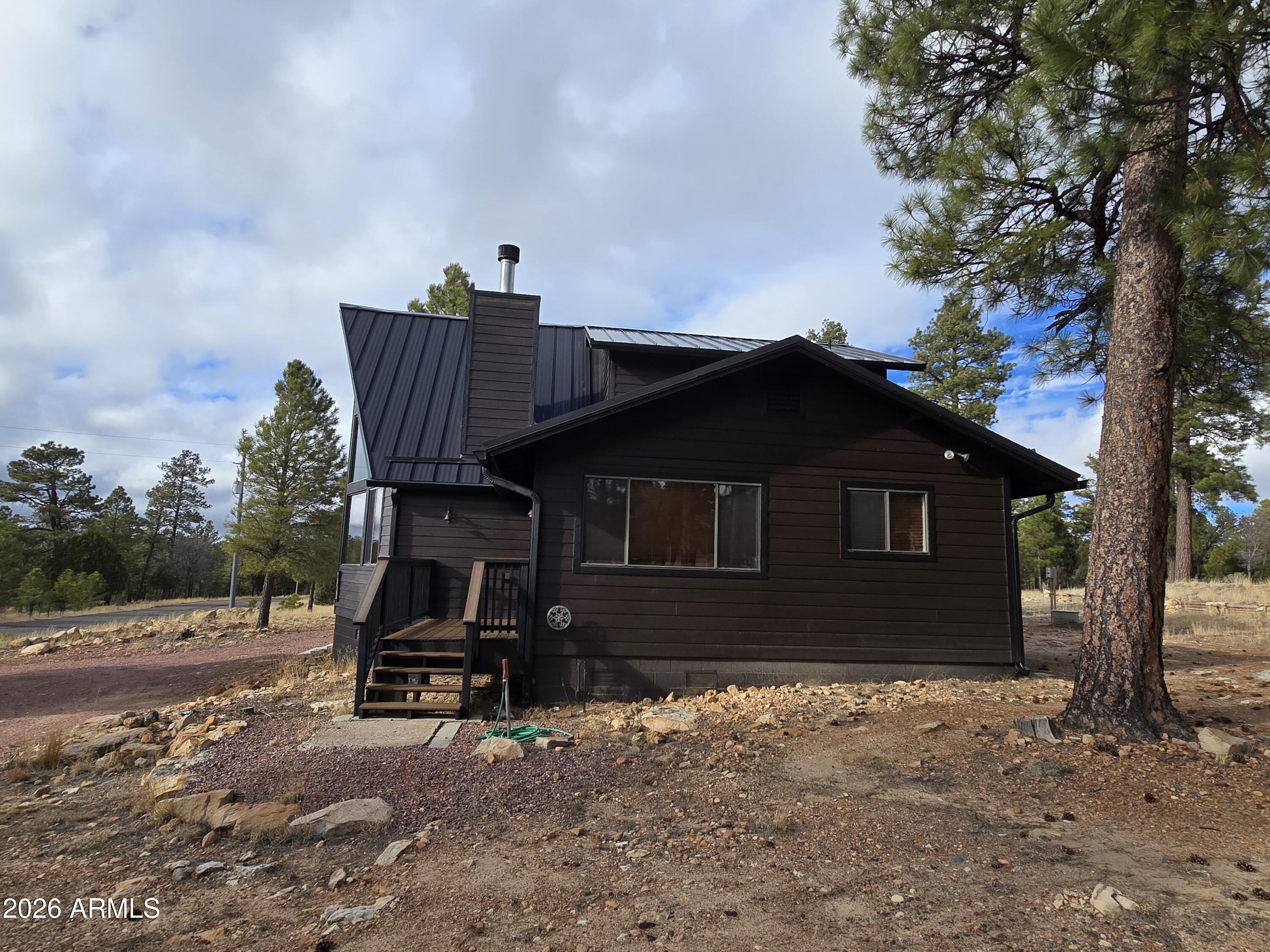 2795 Coyote Ridge Happy Jack, AZ 86024 - Photo 28 of 31 a house view with a outdoor space