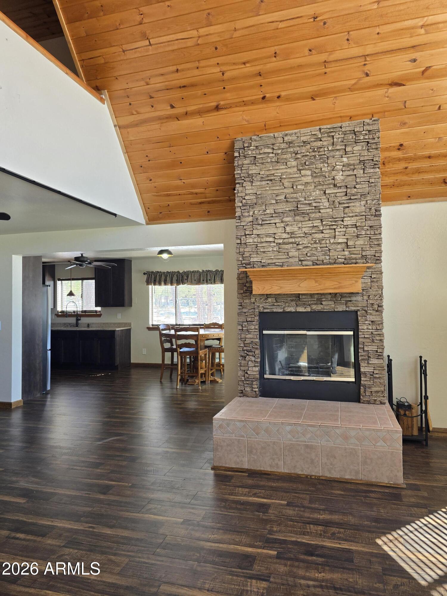 2795 Coyote Ridge Happy Jack, AZ 86024 - Photo 6 of 31 a living room with furniture and a fireplace