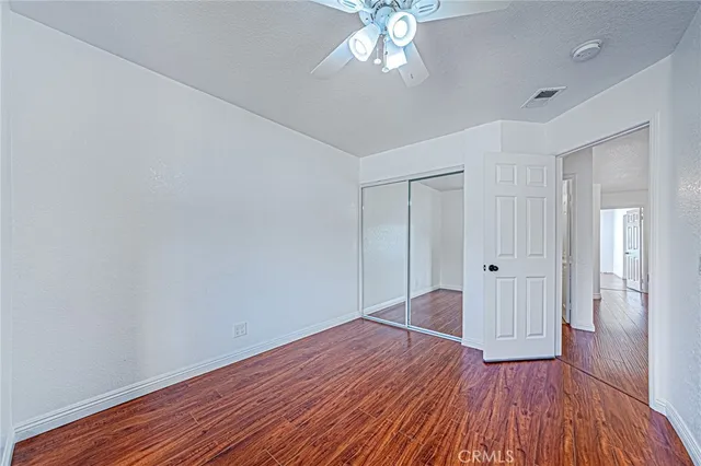 a view of livingroom with hardwood floor and hallway