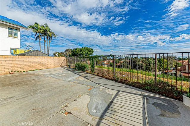 a view of a balcony with wooden floor