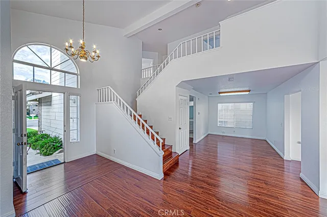 a view of an entryway with wooden floor