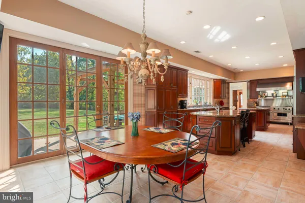 a living room with furniture wooden floor and a large window