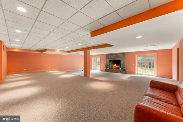 a view of a room with window and a ceiling fan