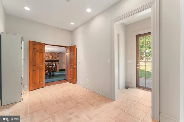 a bathroom with a sink mirror vanity and toilet