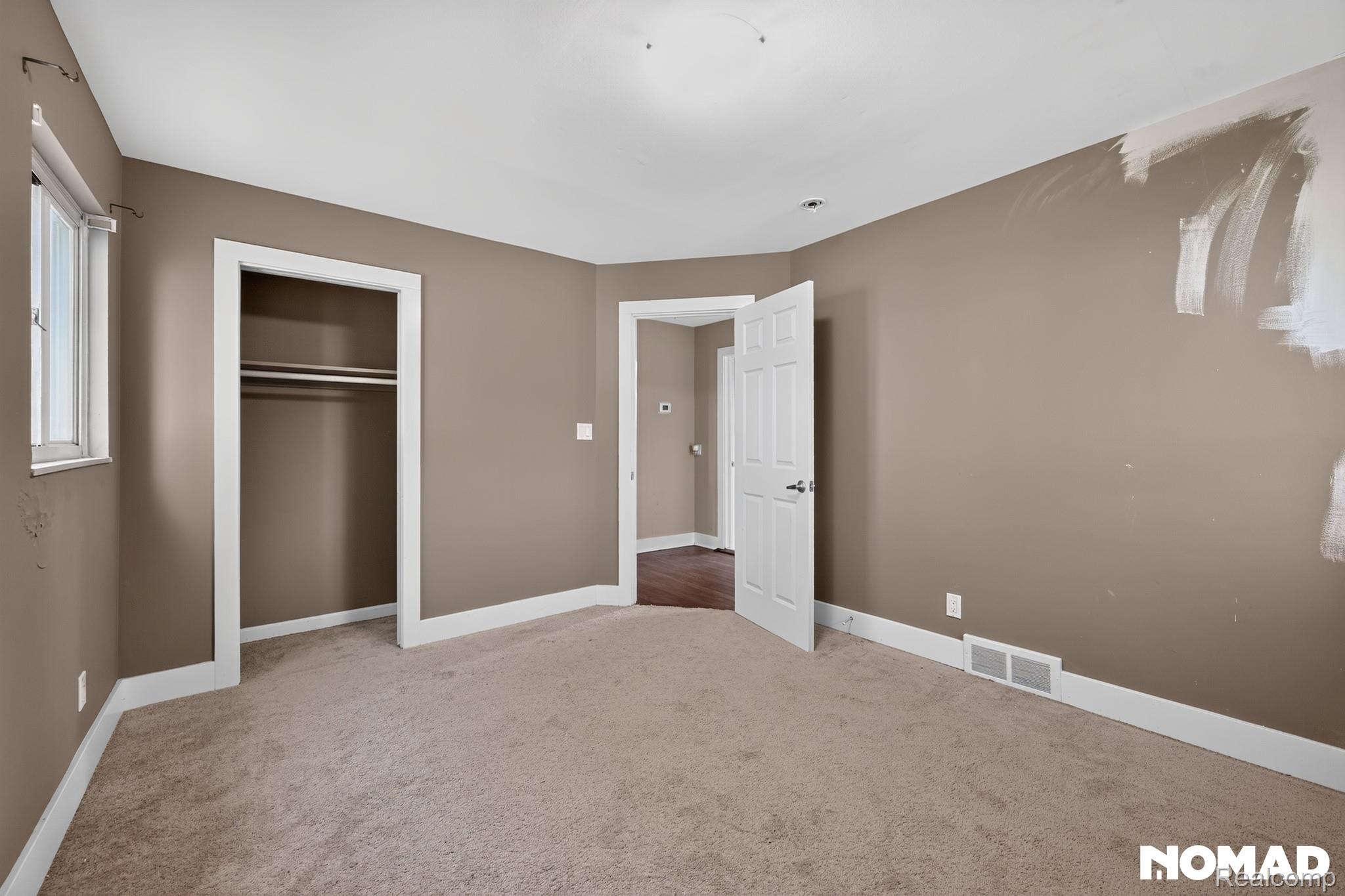 8315 Hilton Road Brighton, MI 48114 - Photo 15 of 26 Carpeted room with neutral wall tones and white baseboards
