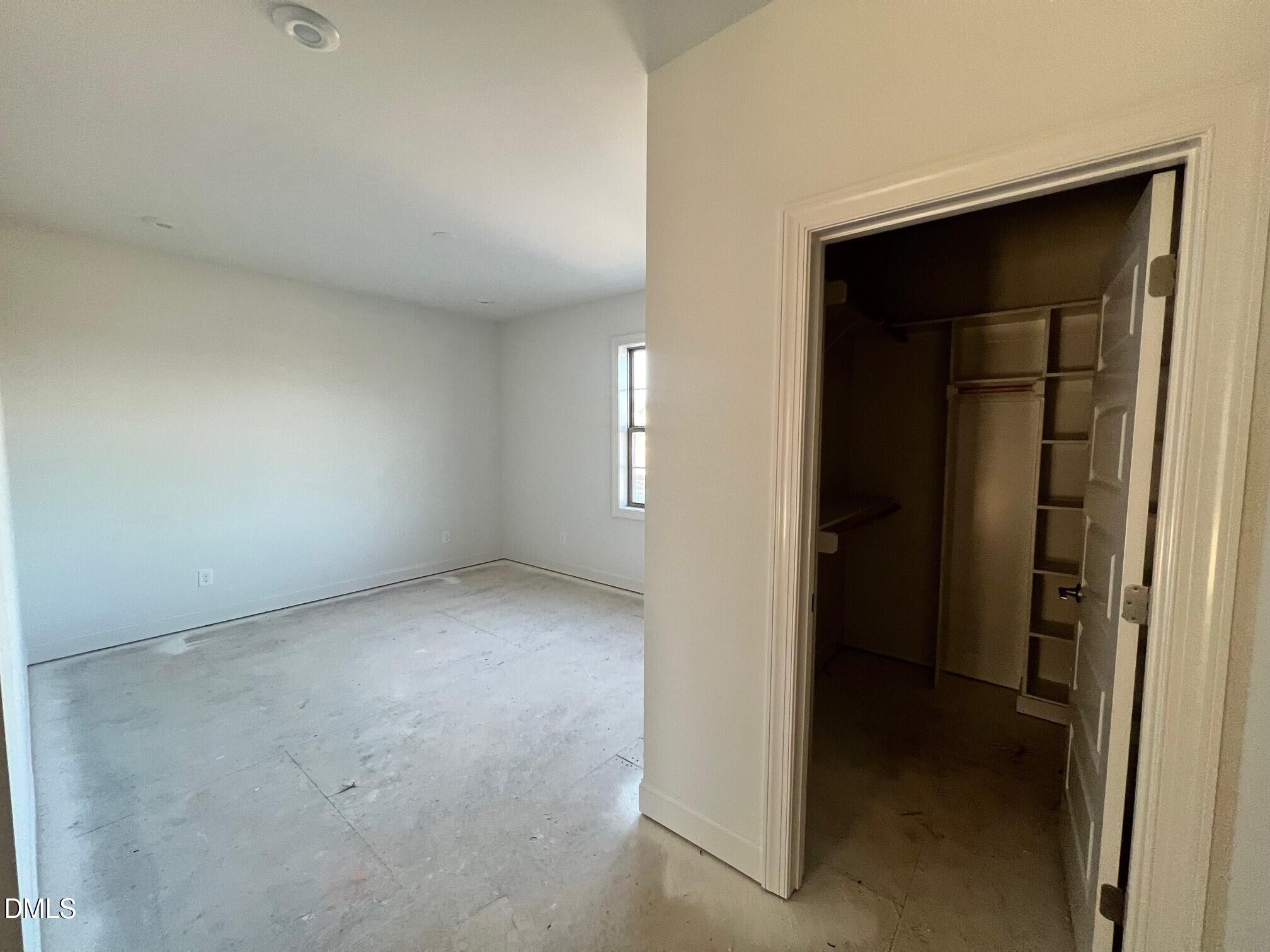 1007 Coldspring Circle Durham, NC 27705 - Photo 16 of 66 an empty room with windows and closet