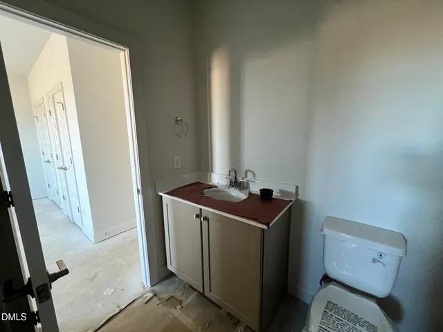 a kitchen with stainless steel appliances sink stove and cabinets