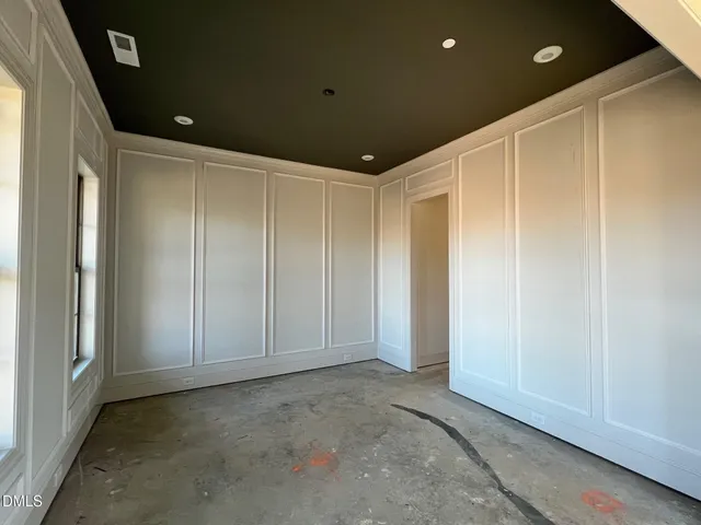 a living room with a fireplace furniture and a rug