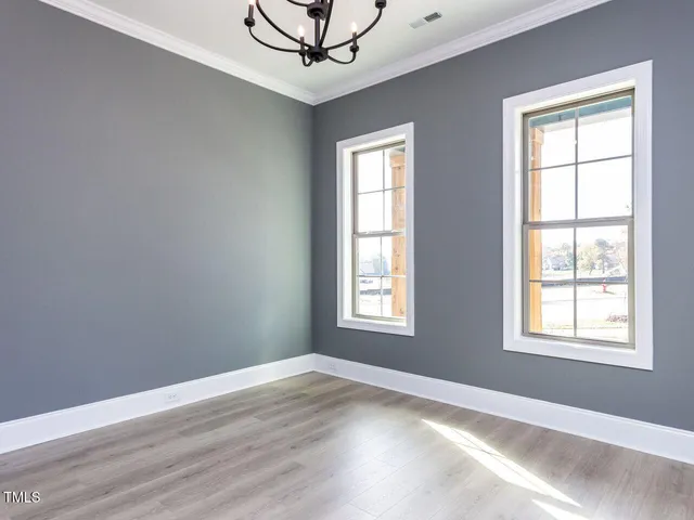 a view of a house with backyard sitting area and garden