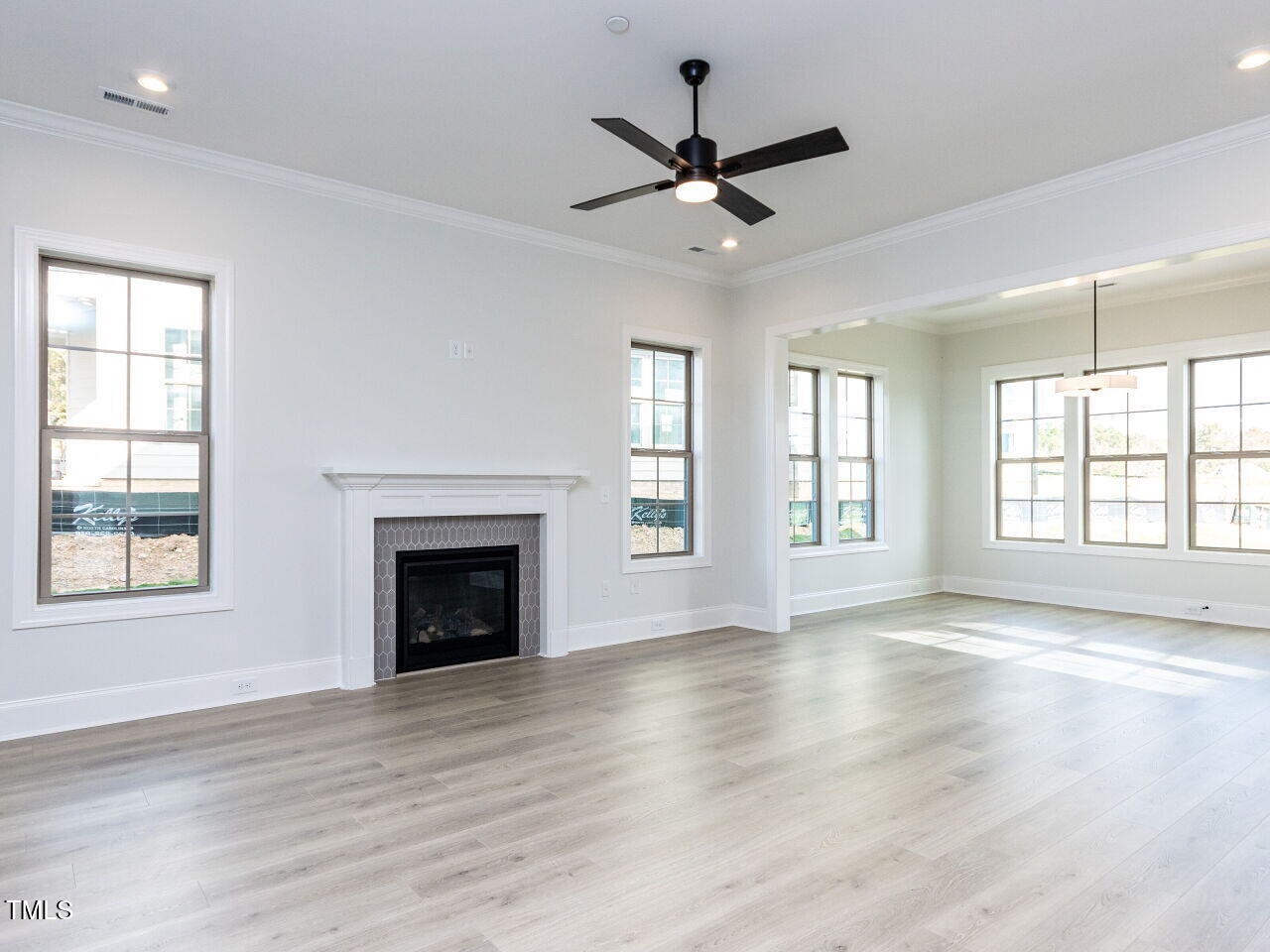1007 Coldspring Circle Durham, NC 27705 - Photo 37 of 66 a view of an empty room with wooden floor and a window