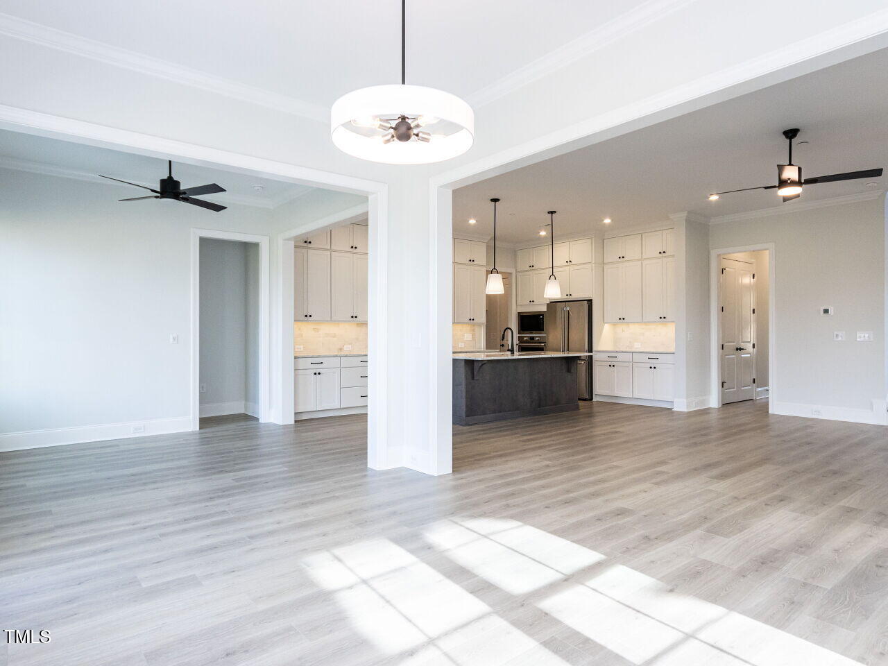 1007 Coldspring Circle Durham, NC 27705 - Photo 42 of 66 a view of a kitchen with a sink and an empty room