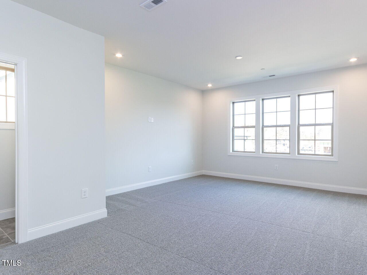 1007 Coldspring Circle Durham, NC 27705 - Photo 56 of 66 an empty room with windows