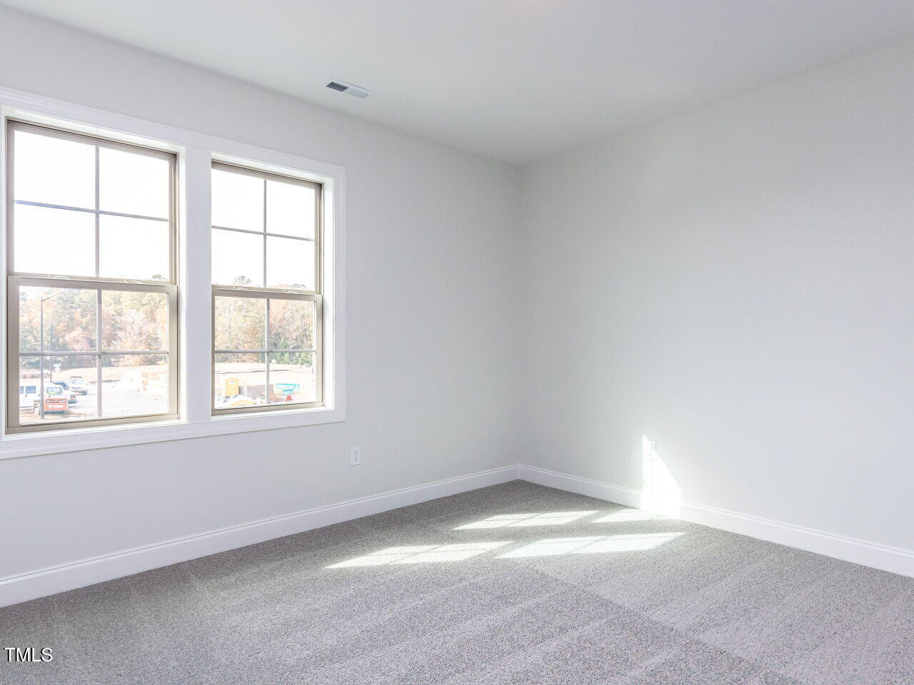1007 Coldspring Circle Durham, NC 27705 - Photo 59 of 66 an empty room with a window