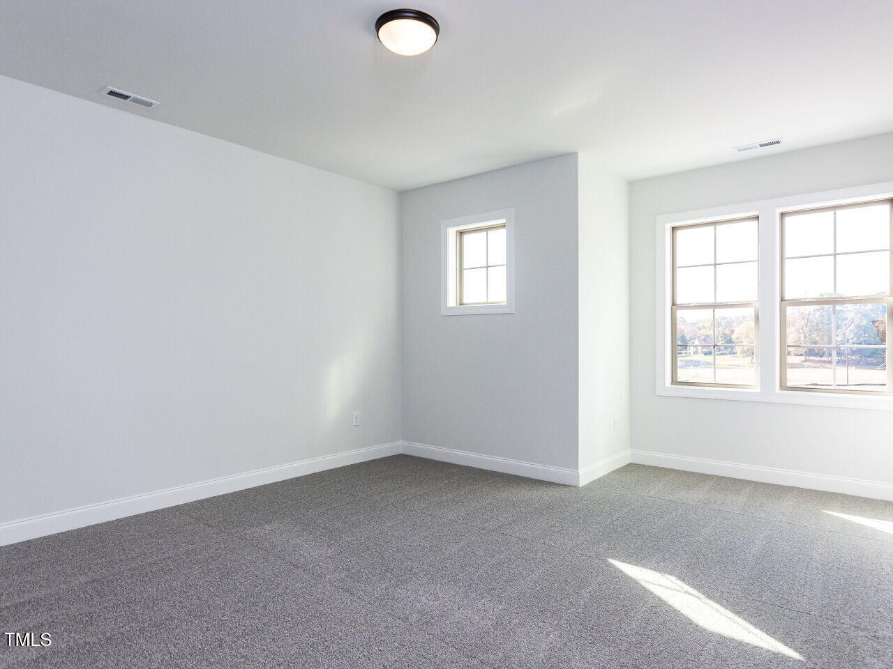1007 Coldspring Circle Durham, NC 27705 - Photo 64 of 66 an empty room with windows