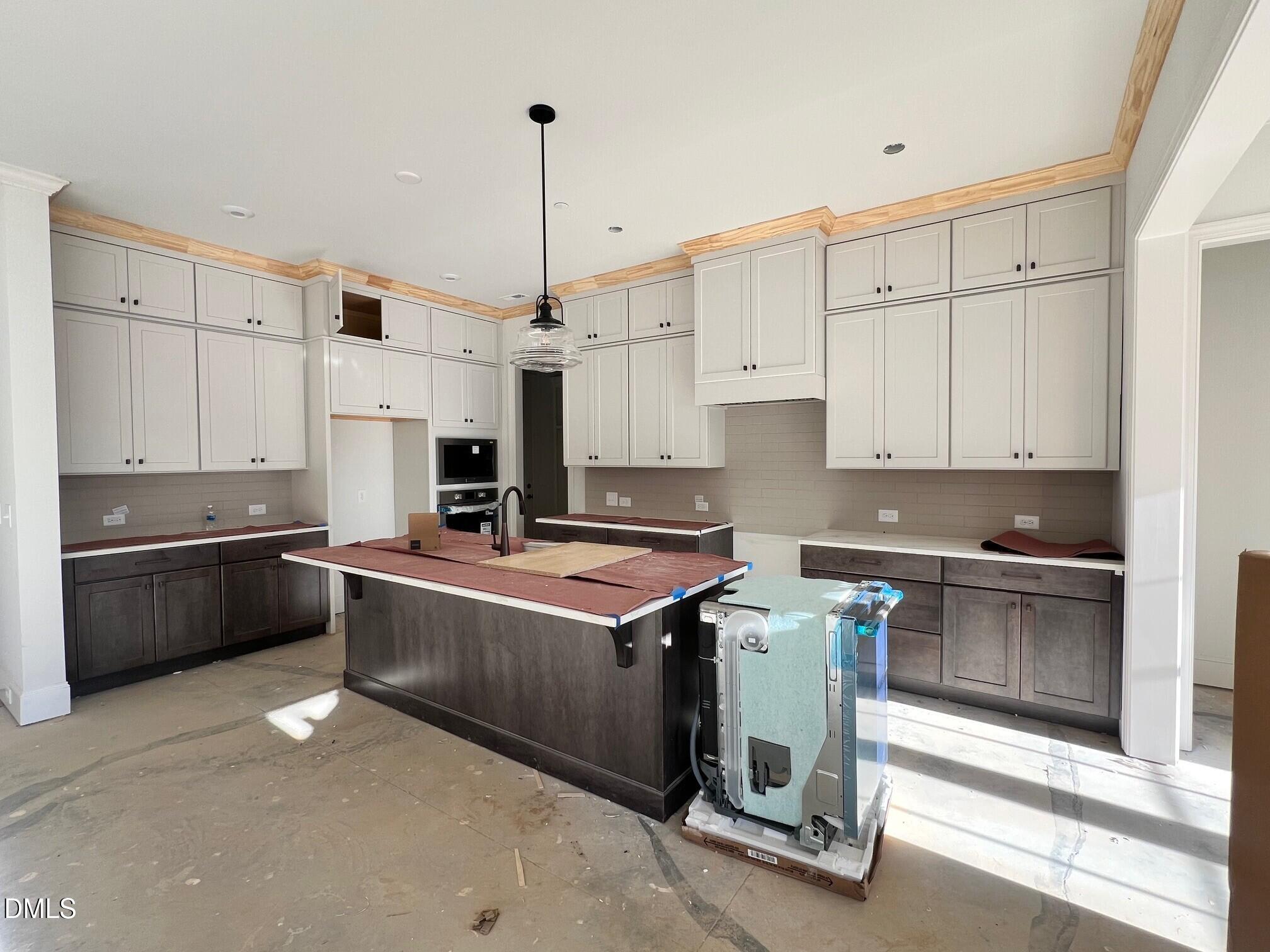 1007 Coldspring Circle Durham, NC 27705 - Photo 7 of 66 a kitchen with stainless steel appliances granite countertop a stove a sink and a refrigerator