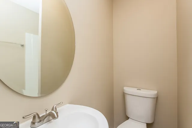 a bathroom with a toilet and a sink